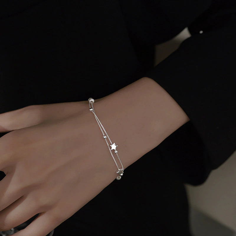 Doppeltes Damen Armband mit Stern und Kugel